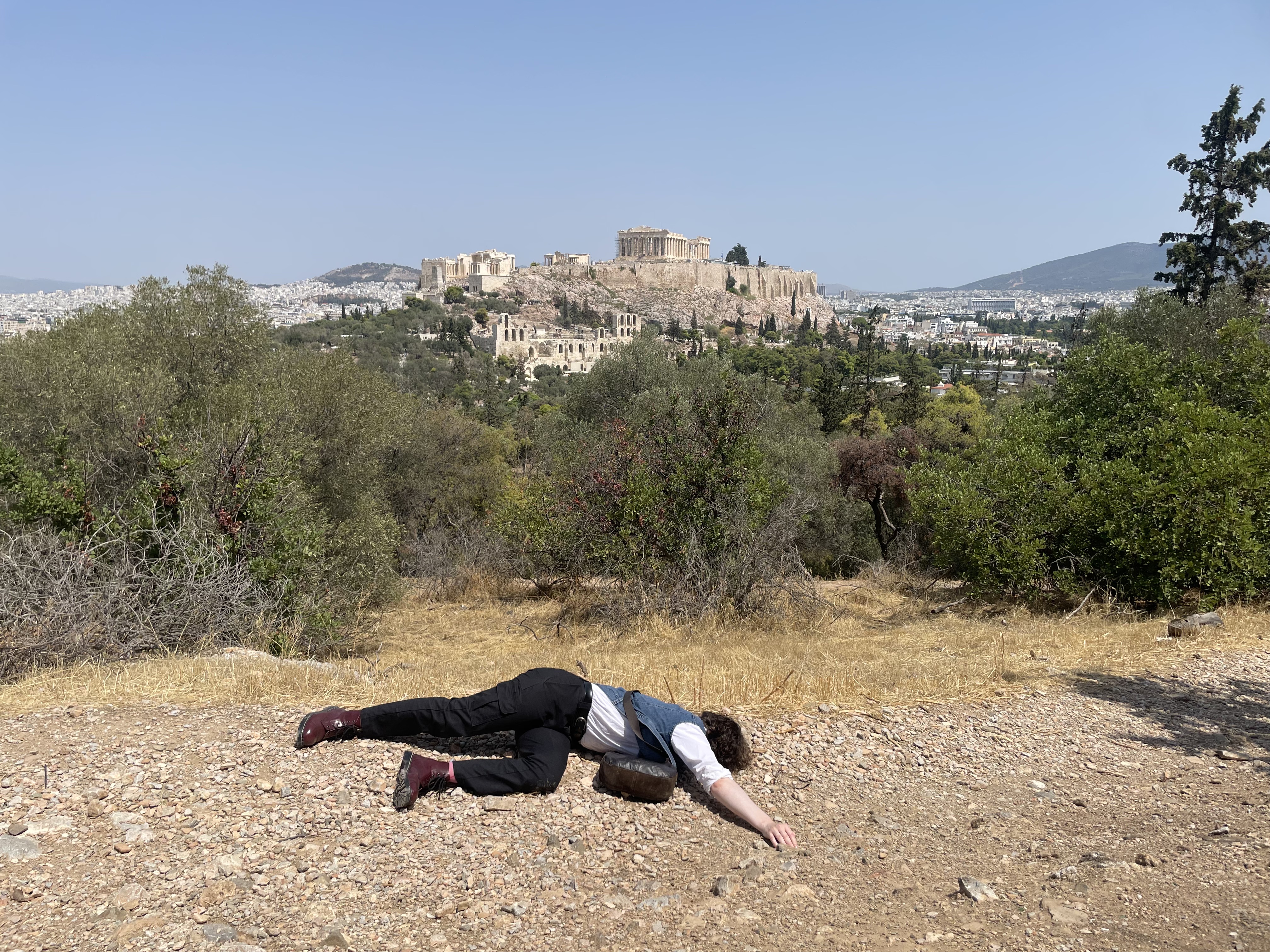 Yvette dead in front of the Acropolis